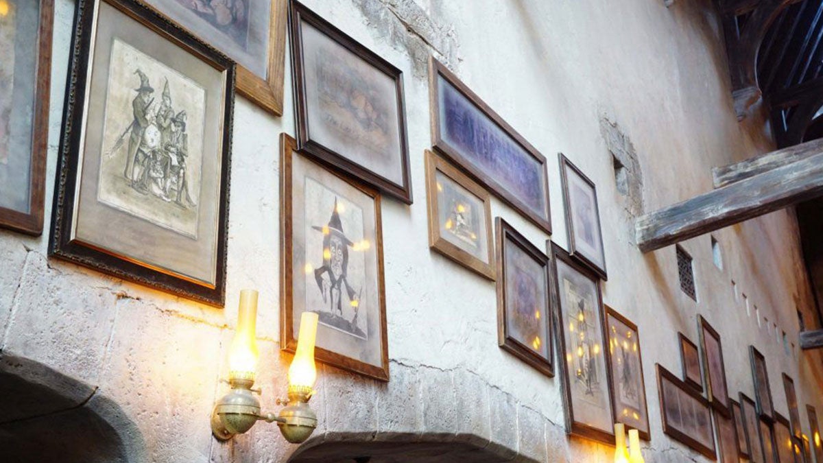 Close up of photos on the wall at Leaky Cauldron Restaurant at Universal Studios in Orlando, Florida, USA